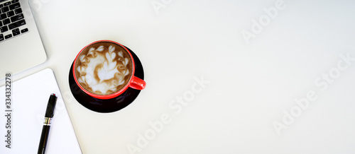 Working with coffee and Laptop computer on table background.Top view style.Minmal workspace,business Concept