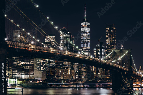 New York City skyline night view. Brooklyn bridge night view. World Trade Center night view.  © tanya