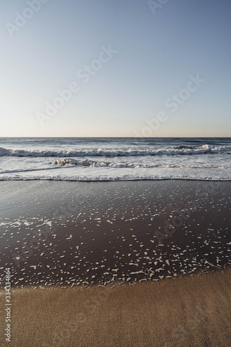 Fototapeta Naklejka Na Ścianę i Meble -  Ocean waves. Blue sky and blue ocean. Atlantic Ocean shore. 