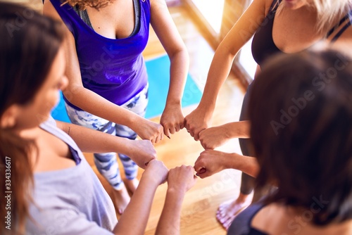 Young beautiful sportwomen doing gesture with hands