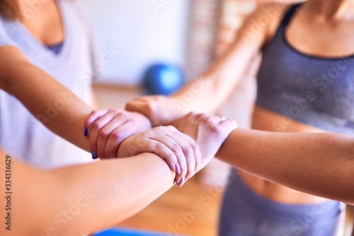 Young beautiful sportwomen doing gesture with hands