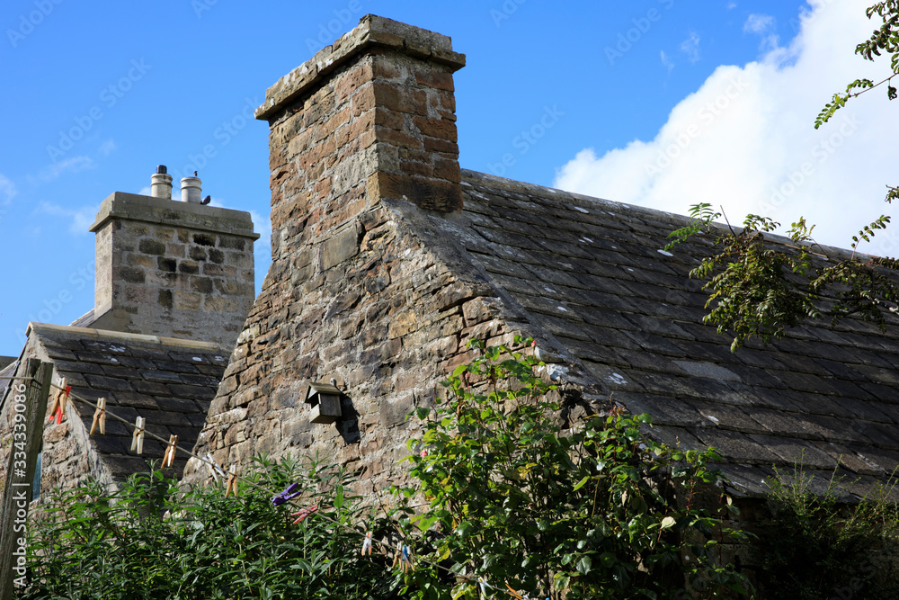 Margaret's Hope - Orkney (Scotland), UK - August 10, 2018: Typical stone house in St Margaret's Hope village, Orkney, Scotland, Highlands, United Kingdom