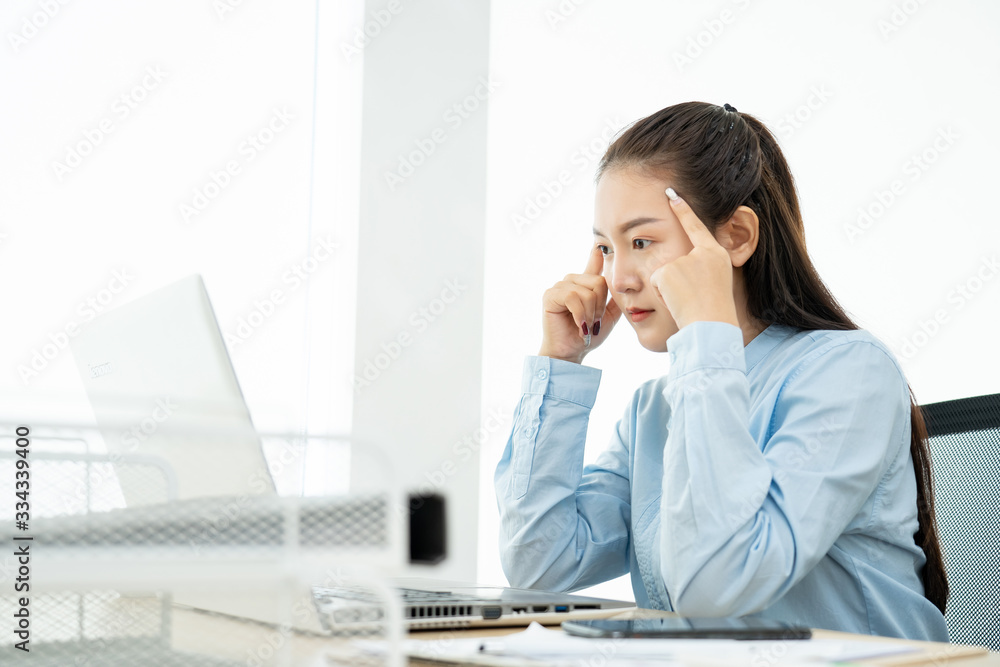 Asian young woman headache and sad depressed in working with friend Encouragement and consolation Asian young woman headache and sad depressed in working with friend Encouragement and consolation