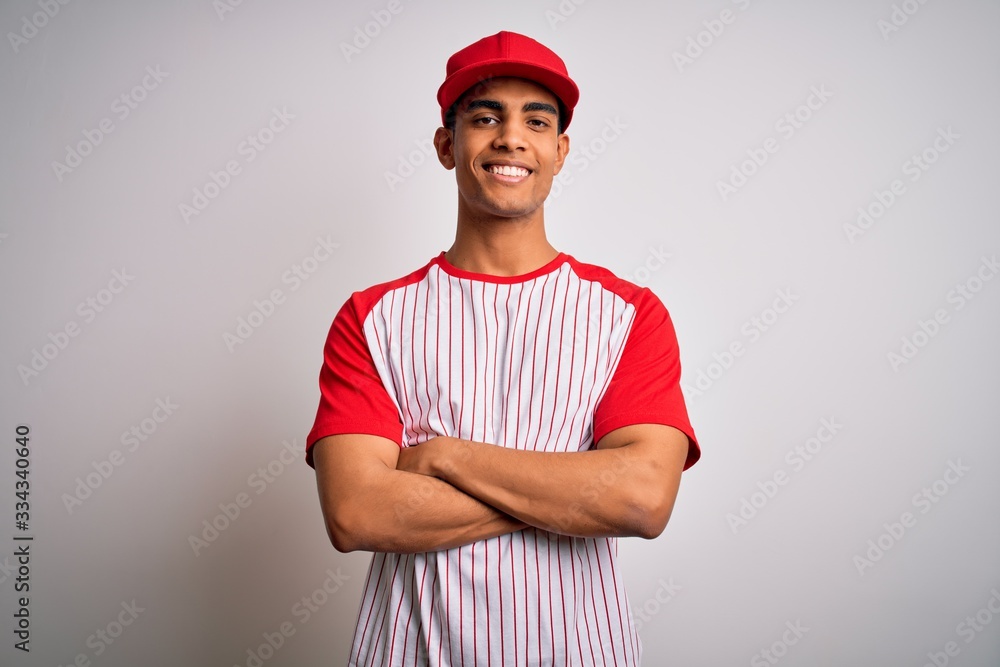 Φωτογραφία Young handsome african american sportsman wearing striped baseball t-shirt and cap happy face smiling with crossed arms looking at the camera