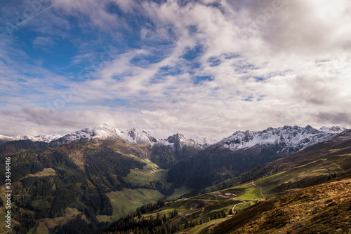 Overlooking a scenic valley in Austria with alpine mountains in the distance