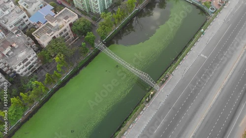 Howrah bridge in Kolkata patuli biswabangla drone footage aerial view floating market. Indian roads and landmarks of subcontinent. photo