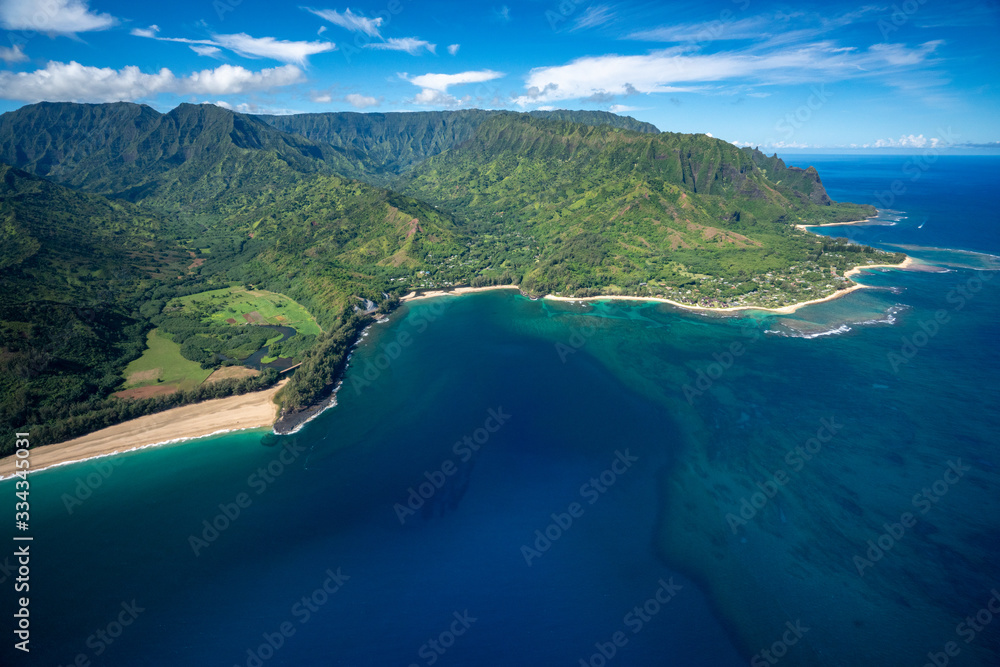 Aerial view of beautiful Na Pali Coast Landscape in Kauai, Hawaii with rugged mountains on a clear summer day