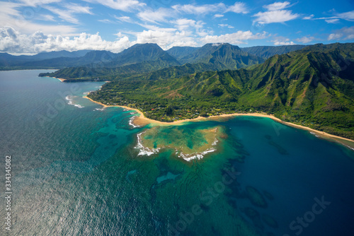 Aerial view of beautiful Na Pali Coast Landscape in Kauai, Hawaii with rugged mountains on a clear summer day