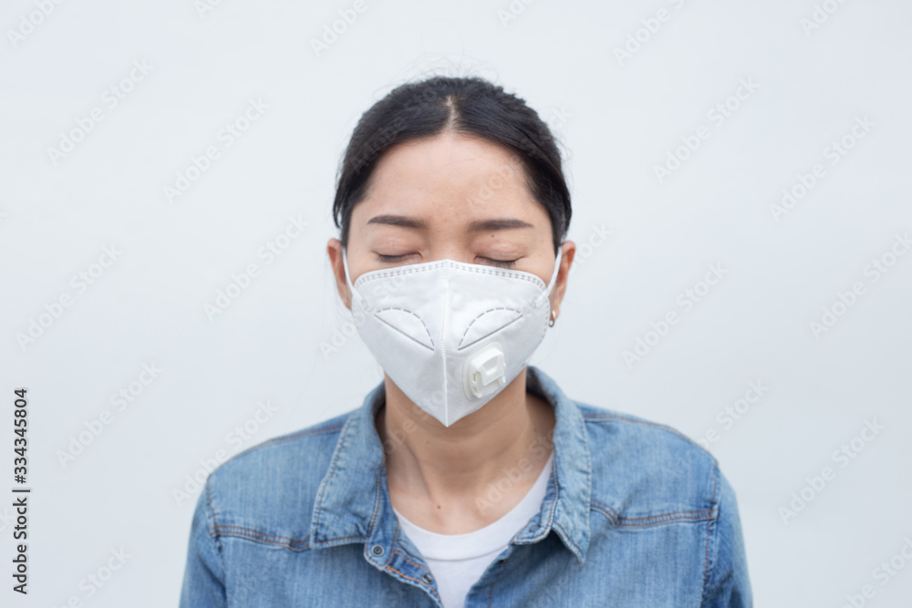 health,medical,environmental pollution concept.woman wearing a mask prevent the outbreak of the virus.Insurance for your healthcare,disease,dust,smoke,dirt in the city health,medical,environmental pollution concept.woman wearing a mask prevent the outbreak of the virus.Insurance for your healthcare,disease,dust,smoke,dirt in the city