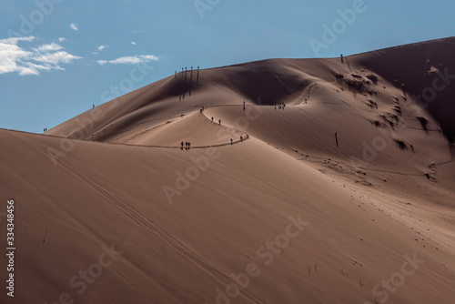 People climbing Large Dunes in Namib Naukluft National Park  Namibia