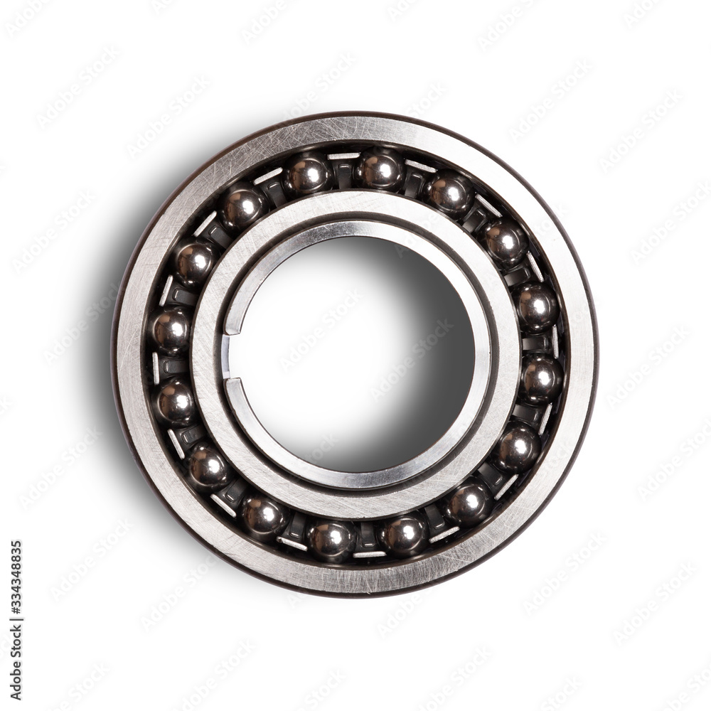 Close up of silver metal bearings for industry on white isolated background. Part of the car Close up of silver metal bearings for industry on white isolated background. Part of the car