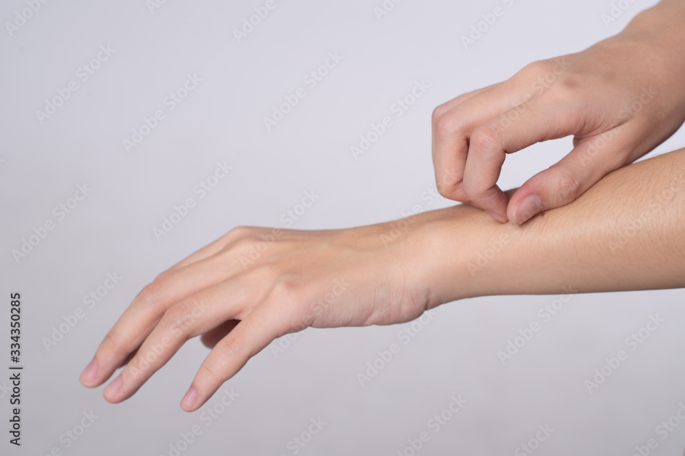 Close up hand of women scratch the itch with hand isolated on white background, Concept with healthcare and medicine.