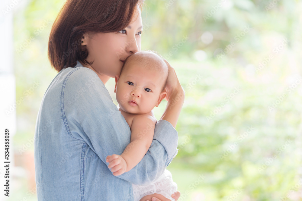 Portrait of happy loving mother and her baby outdoors Portrait of happy loving mother and her baby outdoors