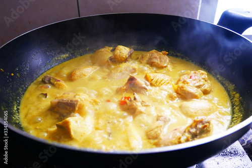 Wallpaper Mural Malaysian Malays traditional cook called Ayam Masak Lemak Chili Padi. It is chicken cooked with a mixture of water, coconut milk, chili turmeric, and water. Torontodigital.ca