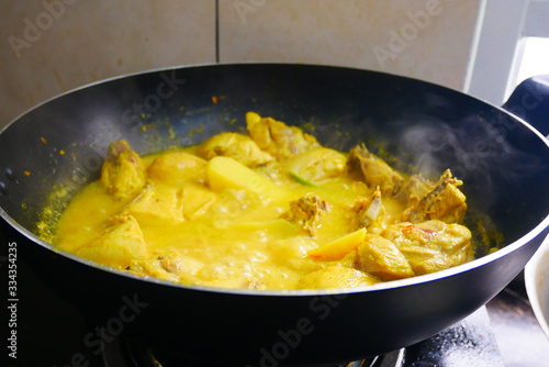 Malaysian Malays traditional cook called Ayam Masak Lemak Chili Padi. It is chicken cooked with a mixture of water, coconut milk, chili turmeric, and water.