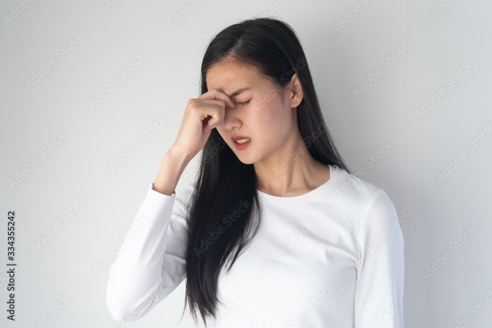 young asian women have a headaches from migraine isolated on white background. young asian women have a headaches from migraine isolated on white background.