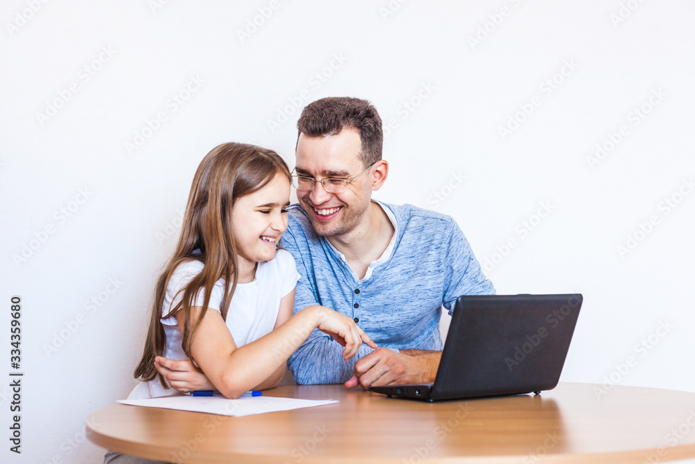 dad and daughter learn via the Internet, remote learning, family help, mom, relatives, time of quarantine and vacation, self-isolation, Skype, use of technology dad and daughter learn via the Internet, remote learning, family help, mom, relatives, time of quarantine and vacation, self-isolation, Skype, use of technology