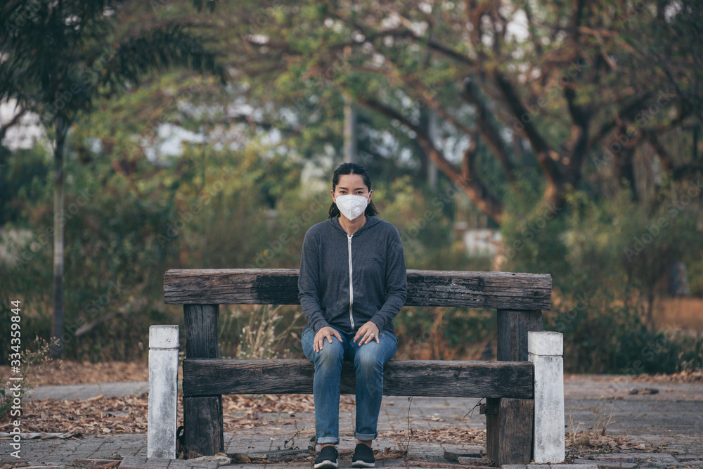 Fototapeta premium woman wearing a mask vent the outbreak of the virus concept for environmental pollution and health,medical.Insurance for your healthcare,disease,dust,smoke,dirt,wildfirein the city