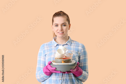 Woman with dirty dishes on ...