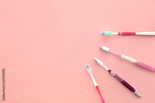 Tooth brushes with paste on color background