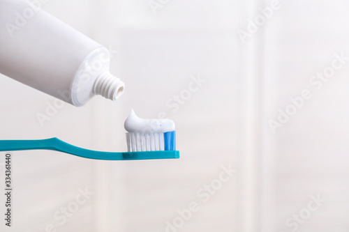 Tooth brush with paste in bathroom