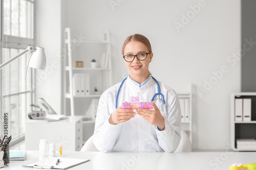 Female doctor with pills bo...