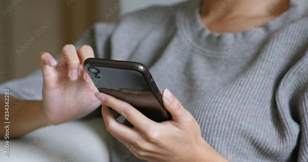 Woman look at mobile phone Woman look at mobile phone