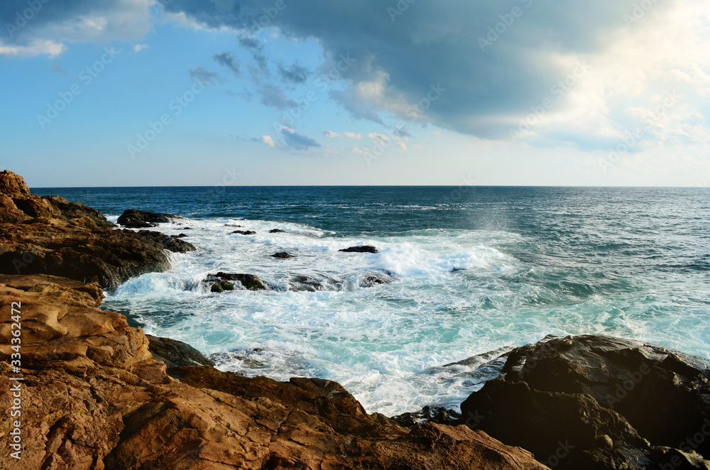 Beautiful Sea Landscape with Waves Breaking in  Rocks
