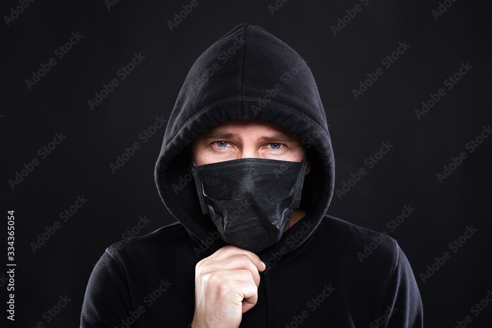 Boy in Black Mask and Hoodie. Coronavirus epidemic Boy in Black Mask and Hoodie. Coronavirus epidemic