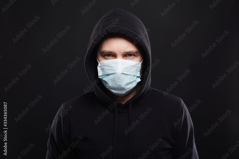 Man in Mask and Hood. Boy in Medicine Mask and Hoodie Man in Mask and Hood. Boy in Medicine Mask and Hoodie