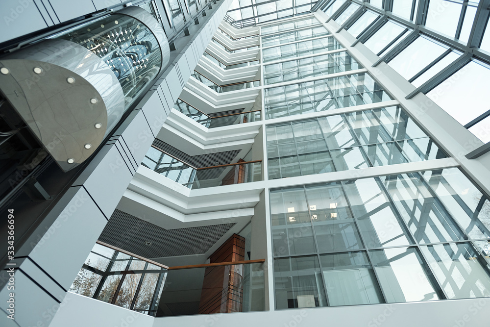 Obraz premium Part of interior of contemporary office center with elevator and balconies