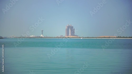 A Timelapse of Boat in Dubai Marina Bay photo