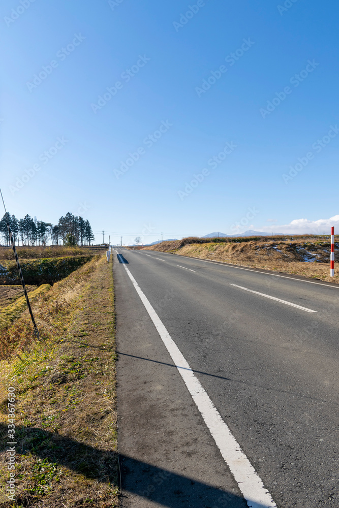 Fototapeta premium Straight road under the sun shine.