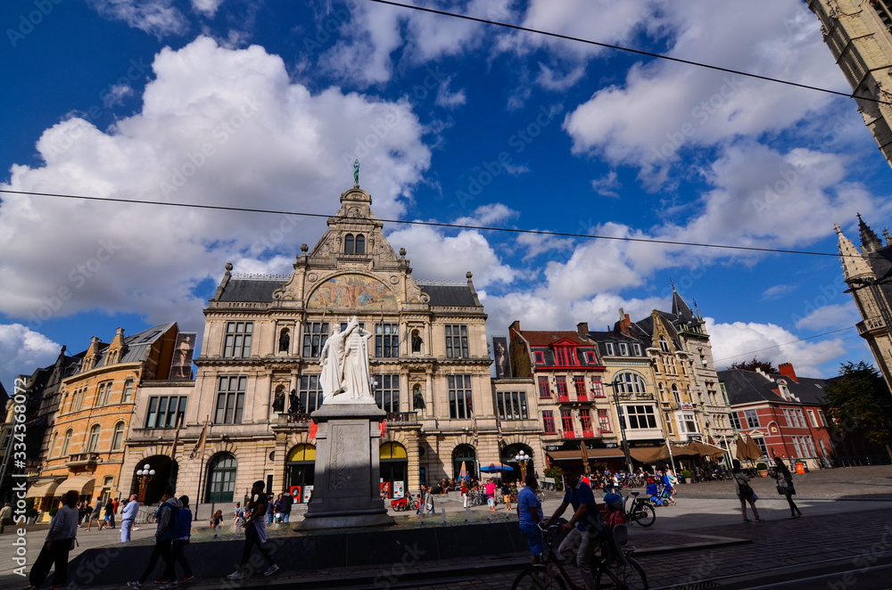 Ghent, Belgium, August 2019. Magnificent buildings overlook the streets of the historic center. In the photo the magnificent theater. People on the street.