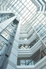 Below view of several business people discussing working points on balcony