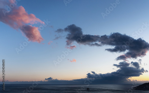 Weather Wallpaper Sea. Pink clouds at sunset.