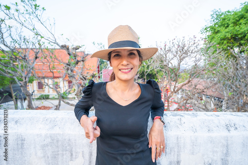 Asian woman with Wat Pong Sanuk background photo