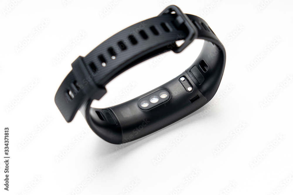 black fitness tracker on a white background, selective focus black fitness tracker on a white background, selective focus