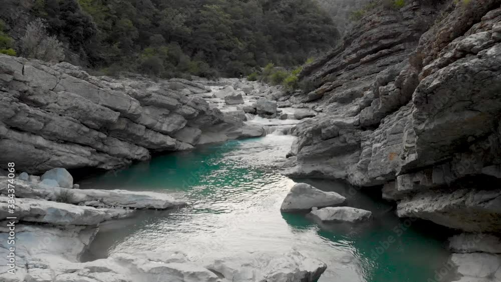 Flight over turquoise water of Emerald River in France upstream, forward aerial Flight over turquoise water of Emerald River in France upstream, forward aerial