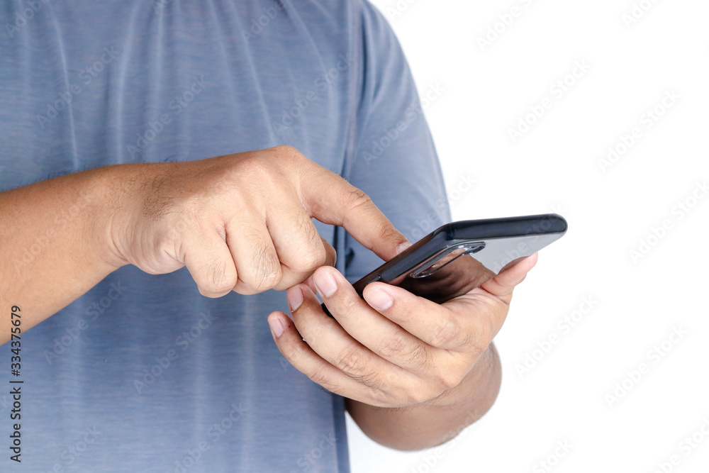 The hand of a man holding a smartphone is pressing a number to contact people. White background. Technology concepts for communication The hand of a man holding a smartphone is pressing a number to contact people. White background. Technology concepts for communication