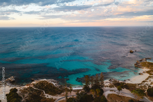 Aerial drone shot of Rottnest Island at sunrise. The Basin and Pinky beach can be seen below.  © Sky Perth