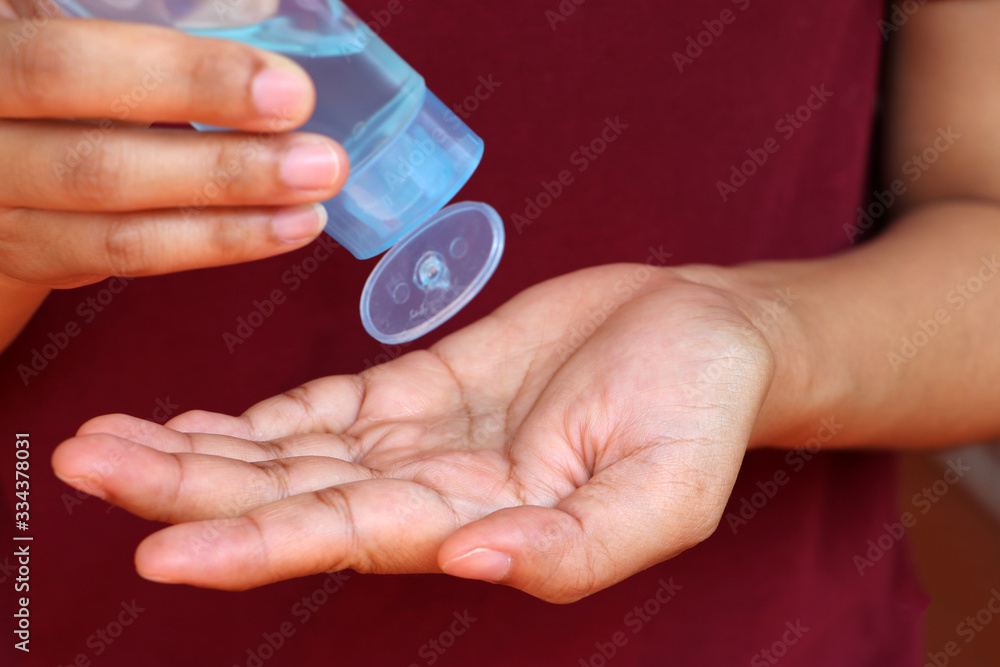 Fototapeta premium Dropping of alcohol gel from the plastic bottle for wash the hand, to killing germs or coronavirus and Covid-19.
