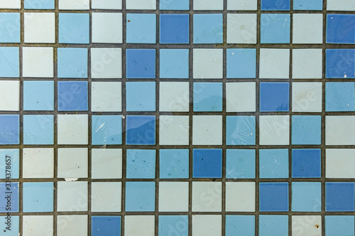 A swimming pool floor tiles on a sunlight