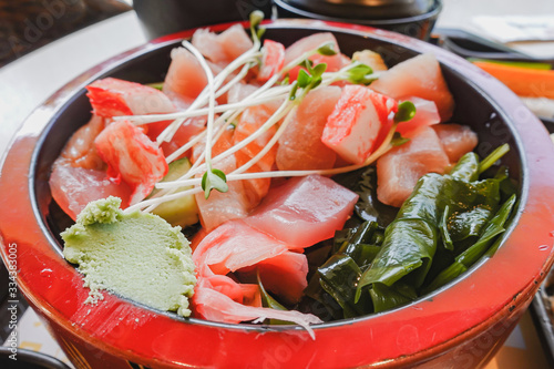 Premium fresh raw seafood mixed rice bowl (Kaisen-don/ Japanese tasty food), Japanese Rice with sashimi of tuna, Maguro, Otoro, and salmon