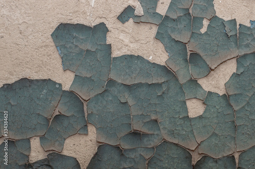 Old painted wall with cracked paint
