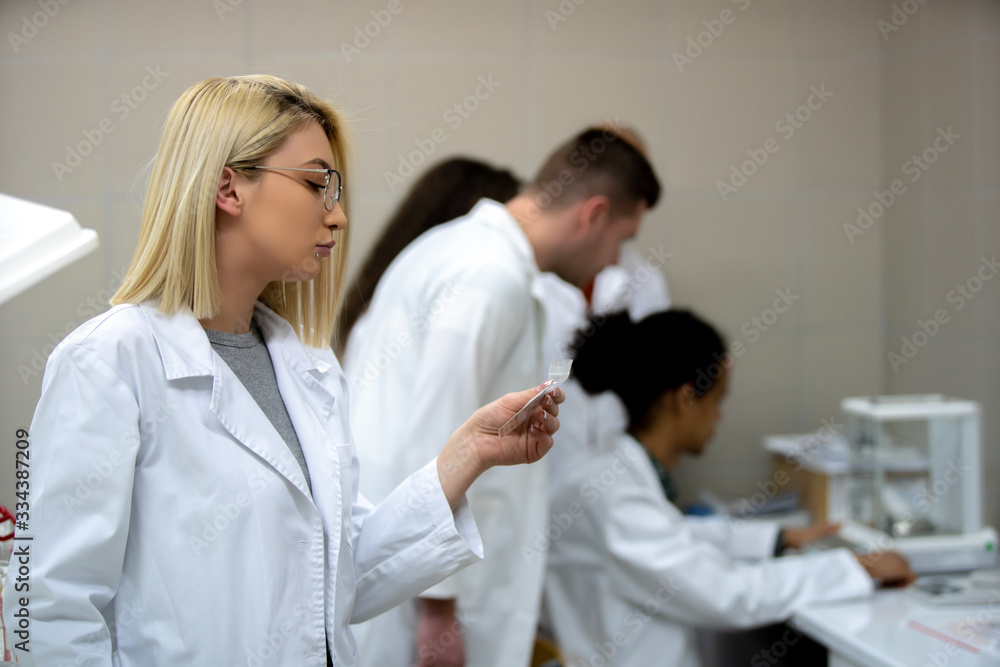 Laboratory scientist working at lab with test tube Laboratory scientist working at lab with test tube