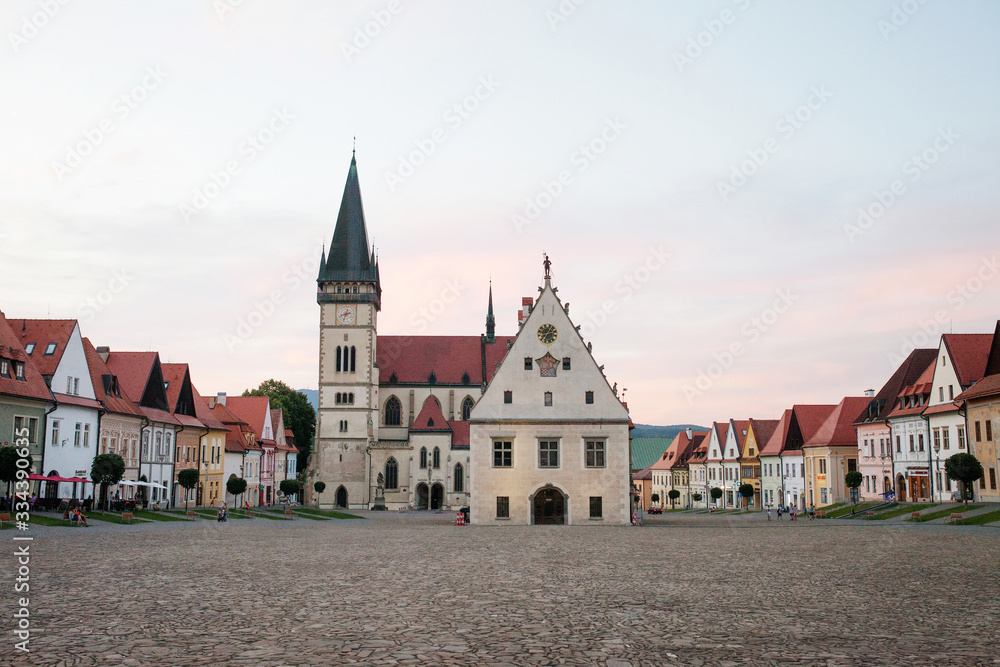 Historic town square in Bardejov, Slovakia with old historical town square with preserved bourgeois houses with colorful facades. Evening time UNESCO world heritage.