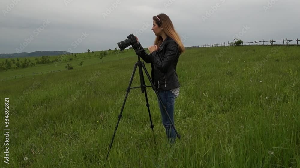 custom made wallpaper toronto digitalGirl photographing nature.Photo camera on a tripod