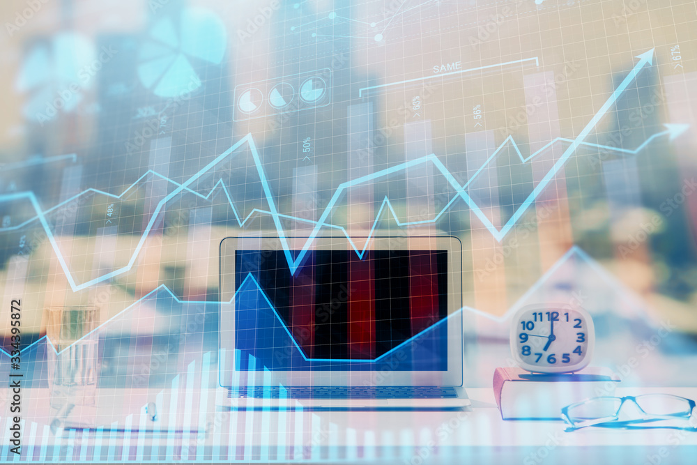 Stock market graph on background with desk and personal computer. Multi exposure. Concept of financial analysis. Stock market graph on background with desk and personal computer. Multi exposure. Concept of financial analysis.