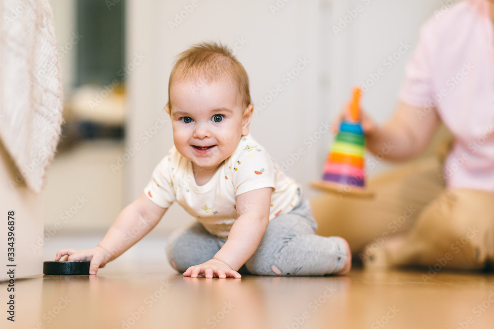 Baby plays with mom. Early development, first games and toys for a baby up to a year Baby plays with mom. Early development, first games and toys for a baby up to a year